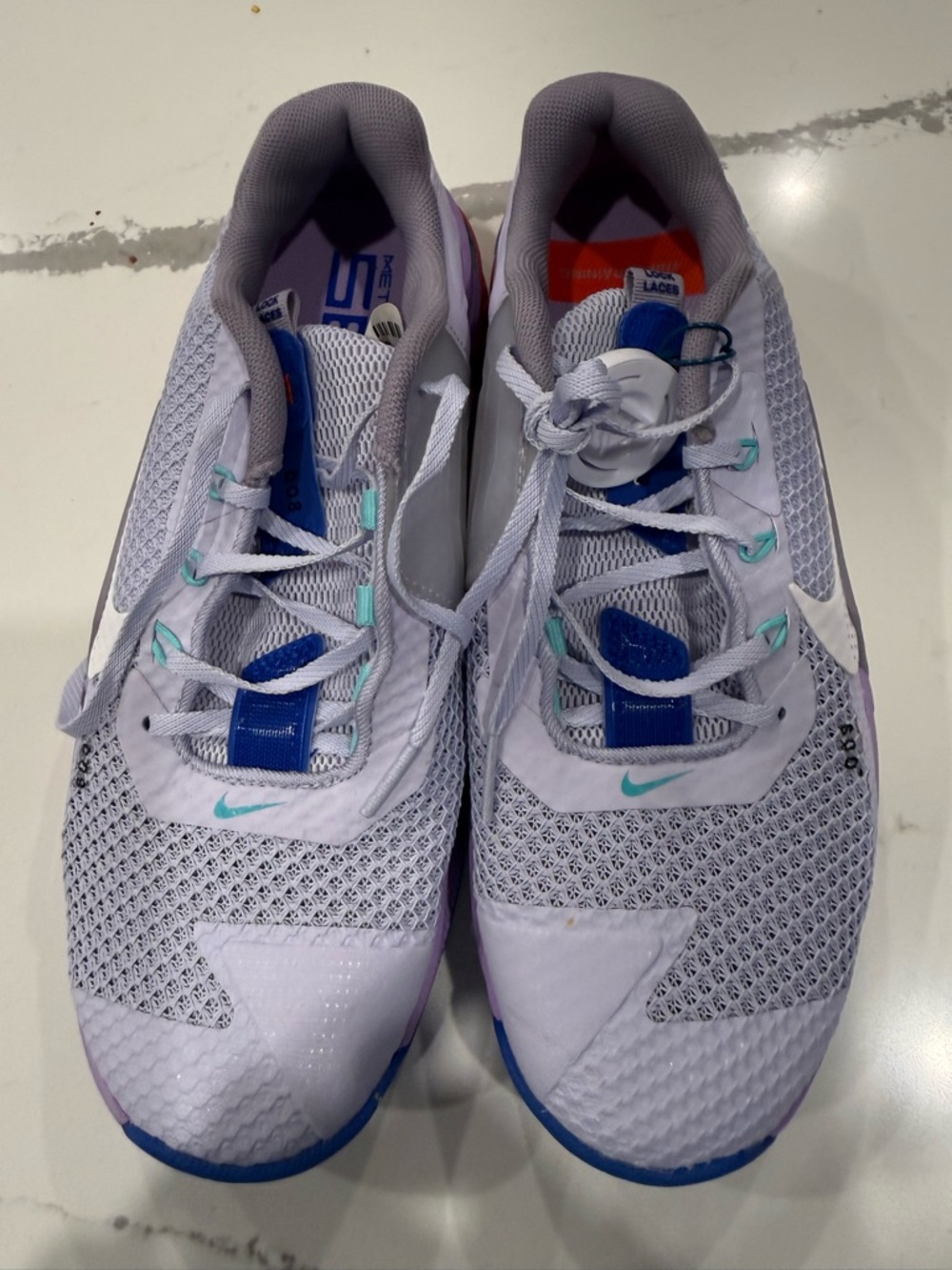 Nike Women’s White Running Shoes with Blue & Teal Accents